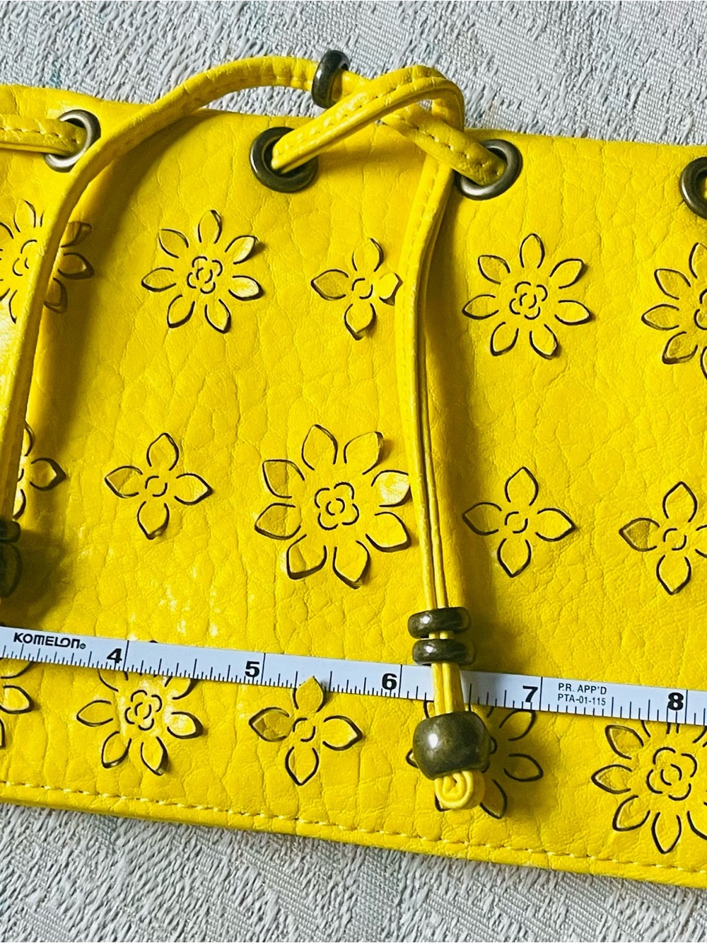 Jessica Simpson Yellow Floral Cutout Drawstring Wristlet
